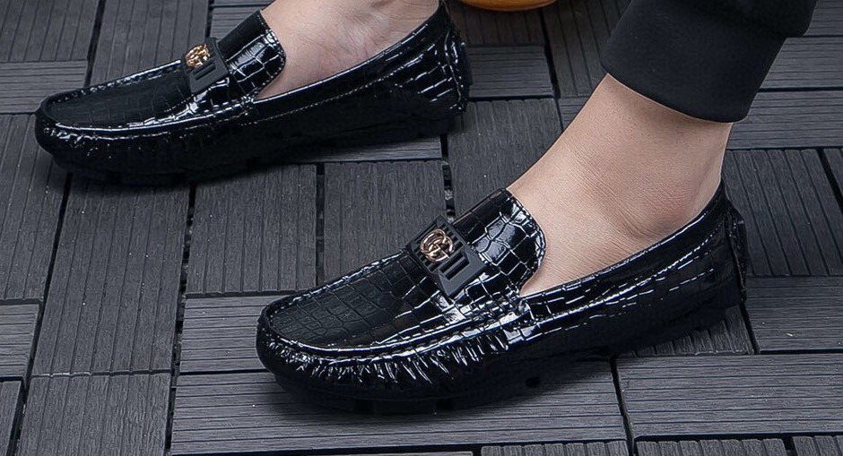 Gucci Black Crocodile-Pattern Loafers — model