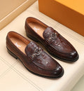 Louis Vuitton Dark Brown Embossed Loafers — hero