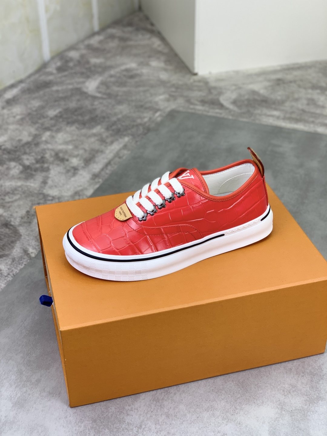 Louis Vuitton Red Embossed Low-Top Sneakers — side