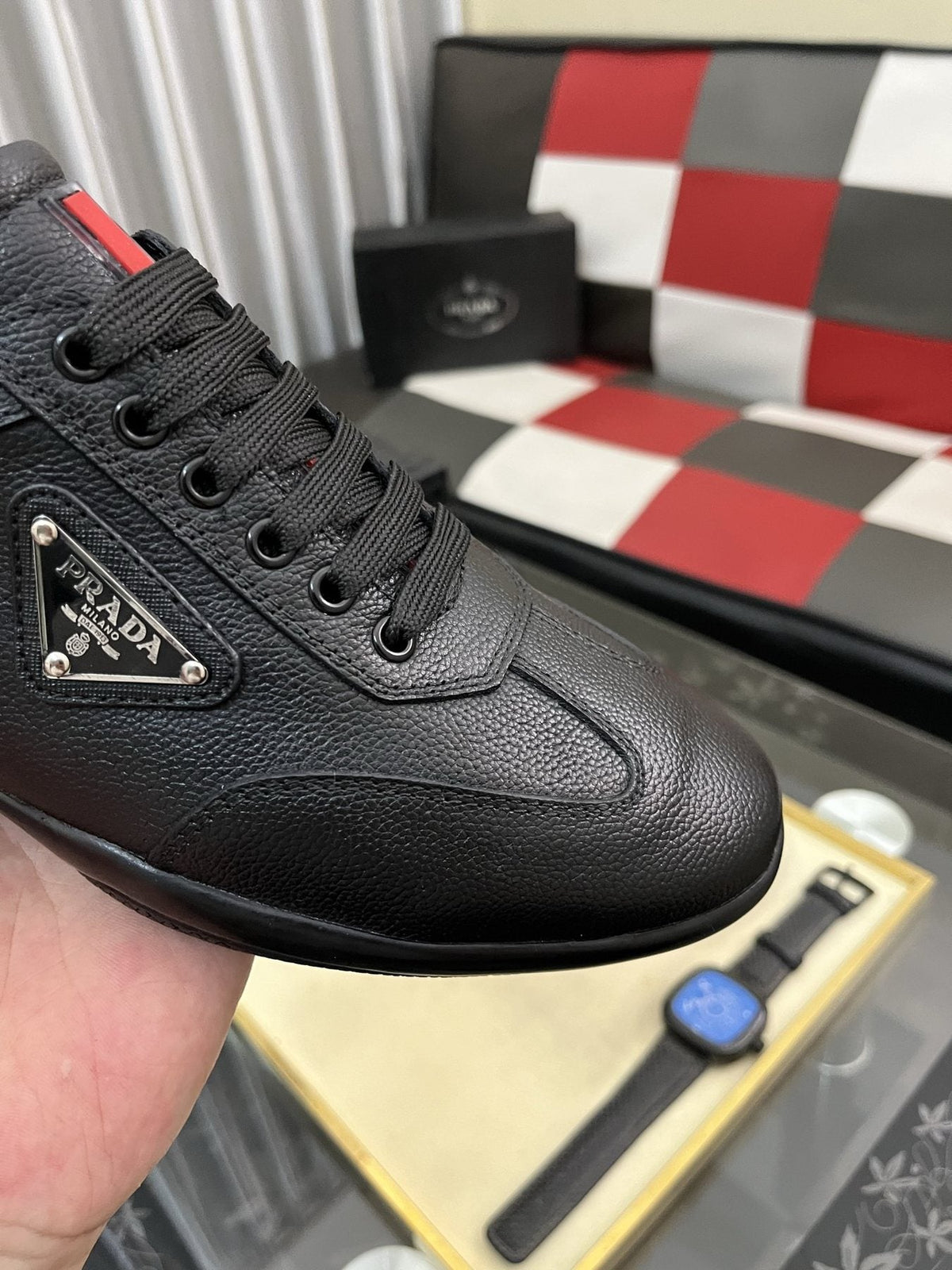 Prada Black Lace-Up Sneakers with Red Tab — detail