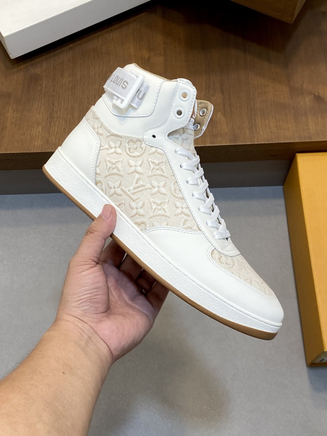 Louis Vuitton Rivoli Patterned High-Top Sneakers — model