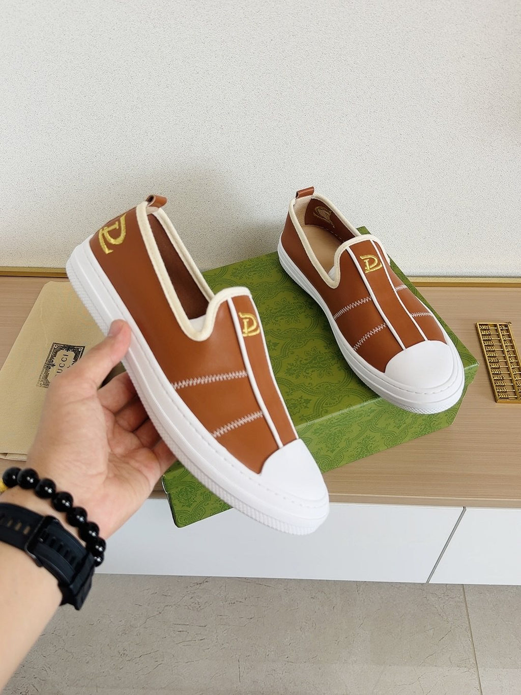 Gucci Brown Slip-On Sneakers with White Toe Caps — model