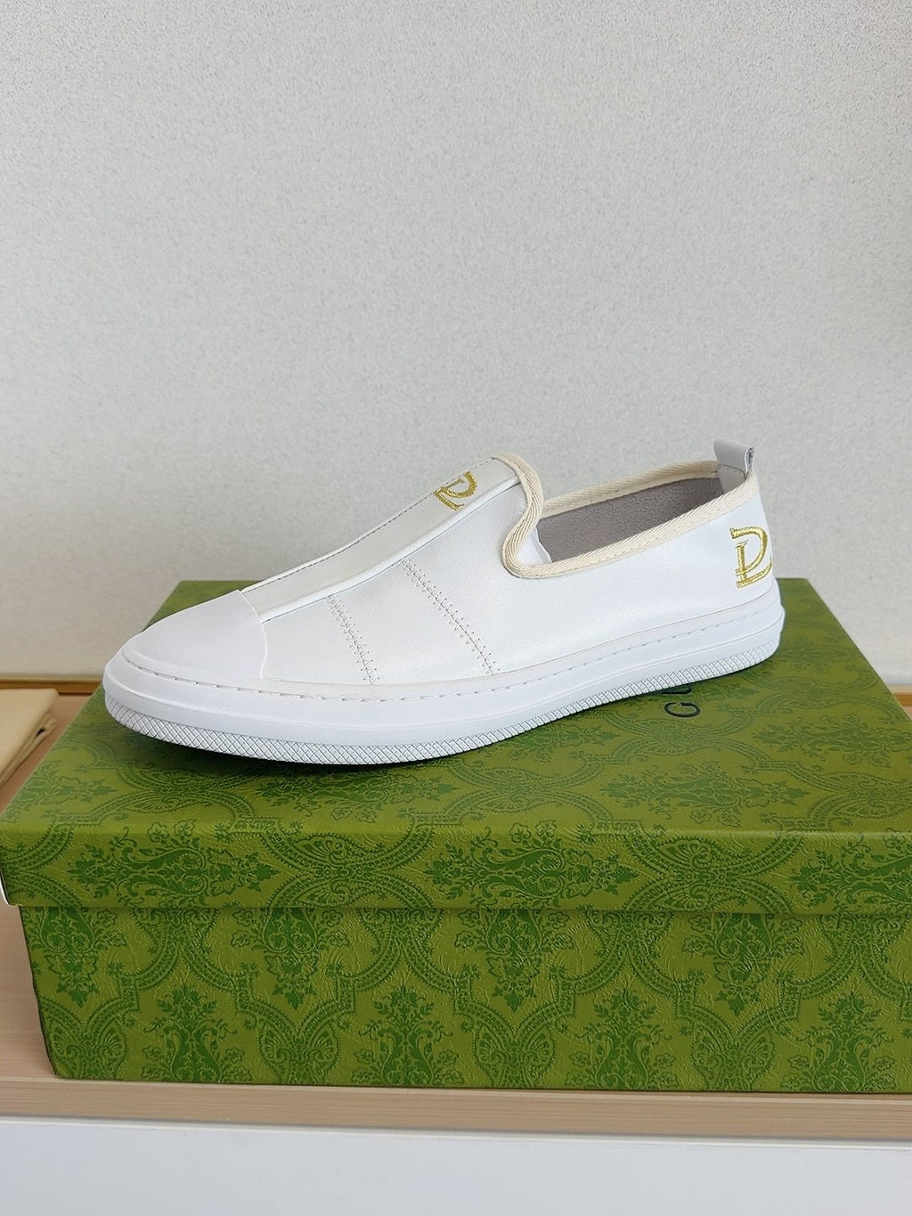 Gucci Brown Slip-On Sneakers with White Toe Caps — side