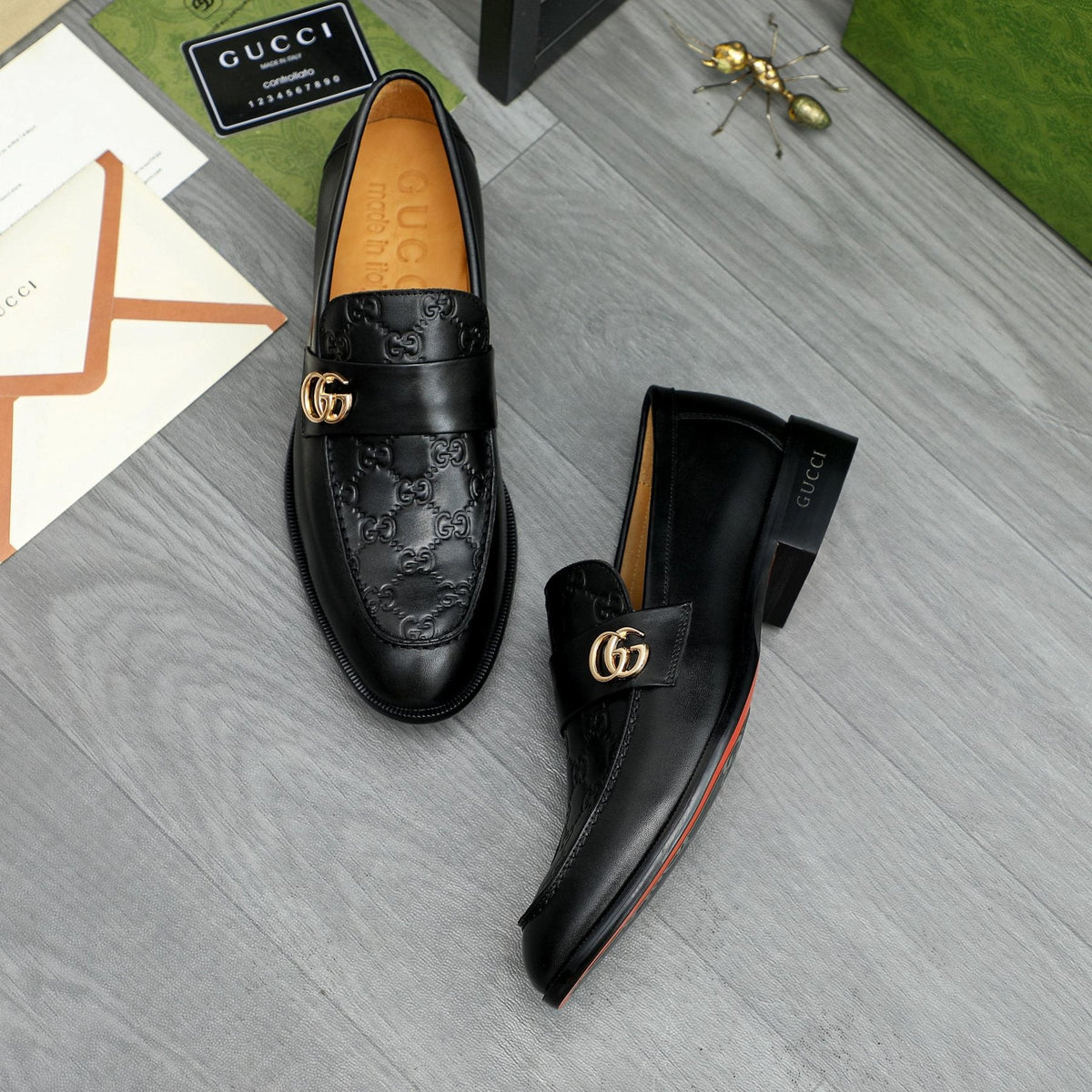 Gucci Black Embossed Loafers with Gold-Tone Detail — front