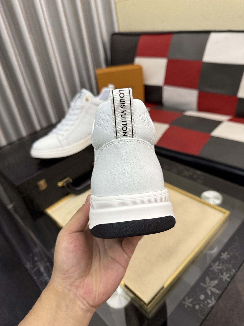 Louis Vuitton Embossed High-Top Sneakers — back