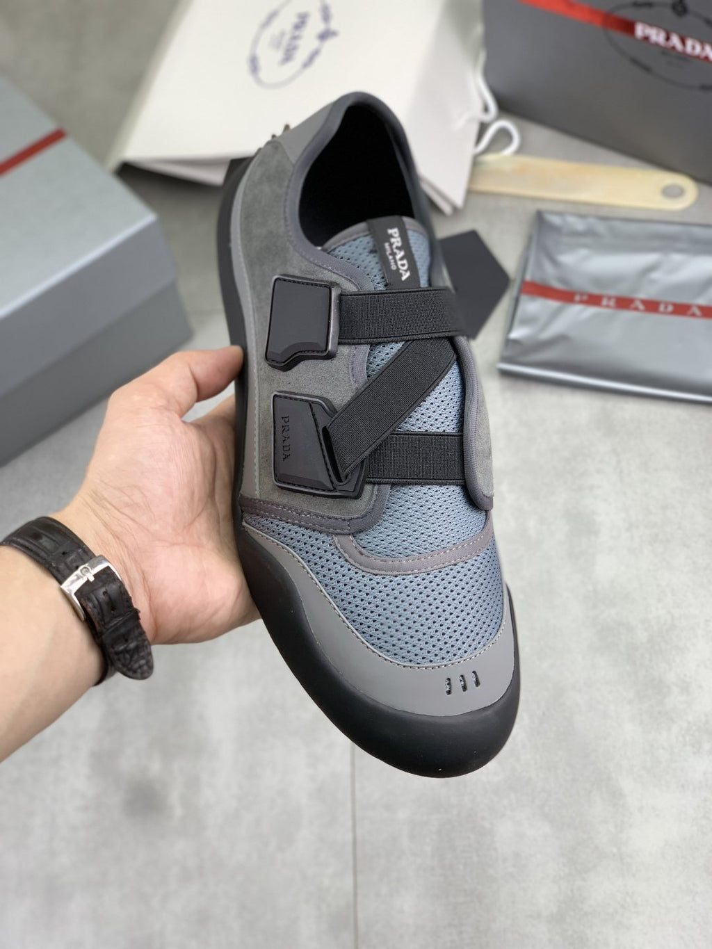 Prada Cross-Strap Low-Top Sneakers — model