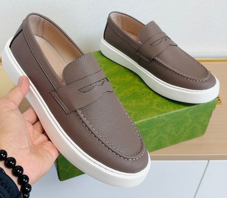 Gucci White-Sole Penny Loafers — hero